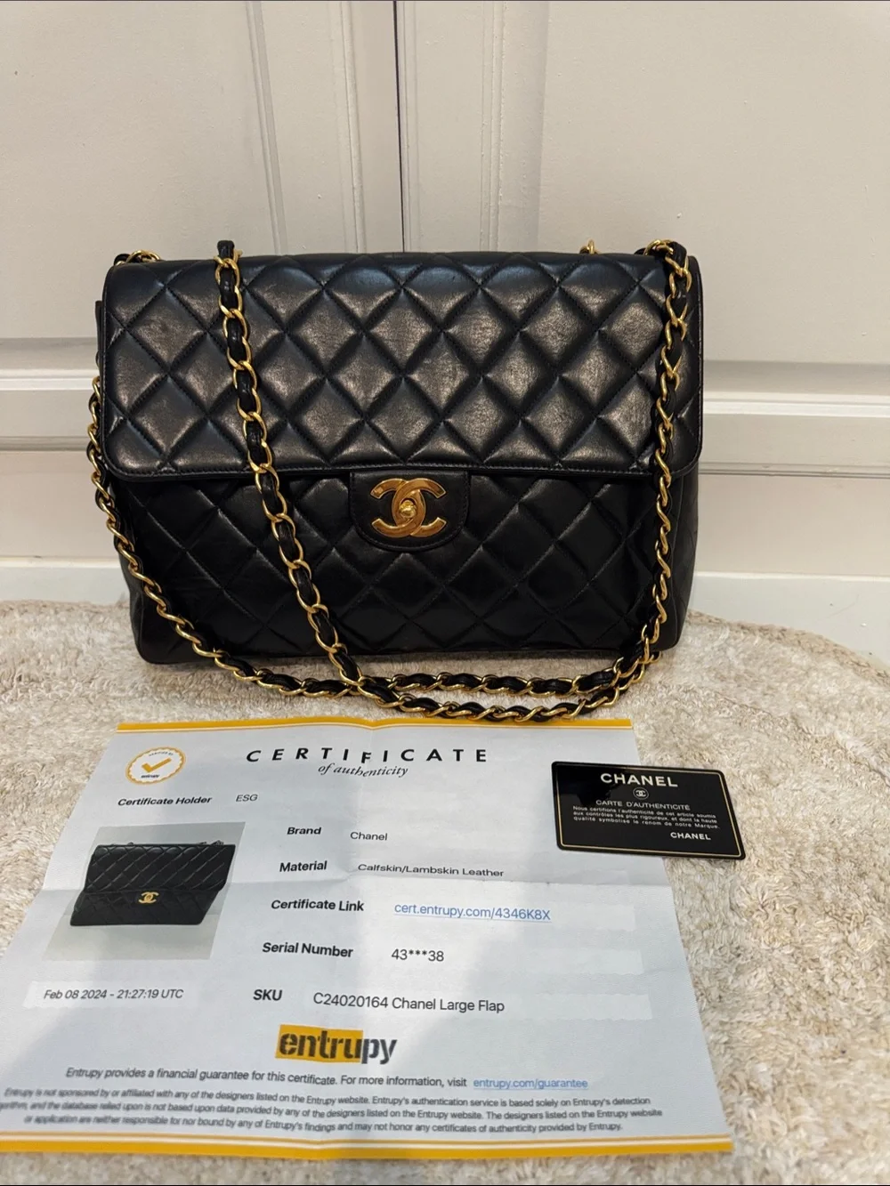 CHANEL Black Quilted Jumbo Lambskin Flap Bag with Gold 24kt Hardware